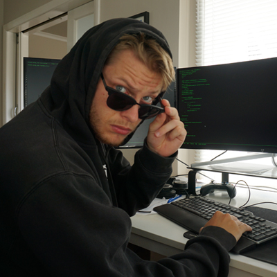 Me hacking at the computer with sunglasses on